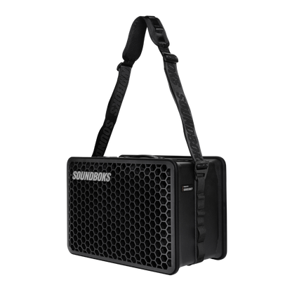 SOUNDBOKS Go with a carrier strap